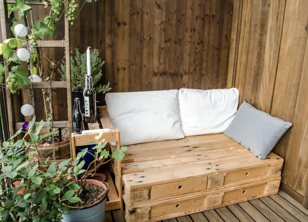 Wooden pallet couch on balcony