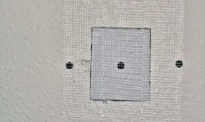 Fibreglass mesh patch to cover a hole in the wall