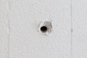 Circular hole in a wall