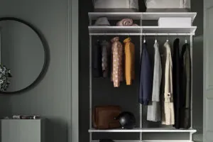 Green closet fixture with hanging rod and shelves