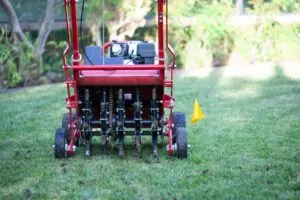 Red lawn aerator